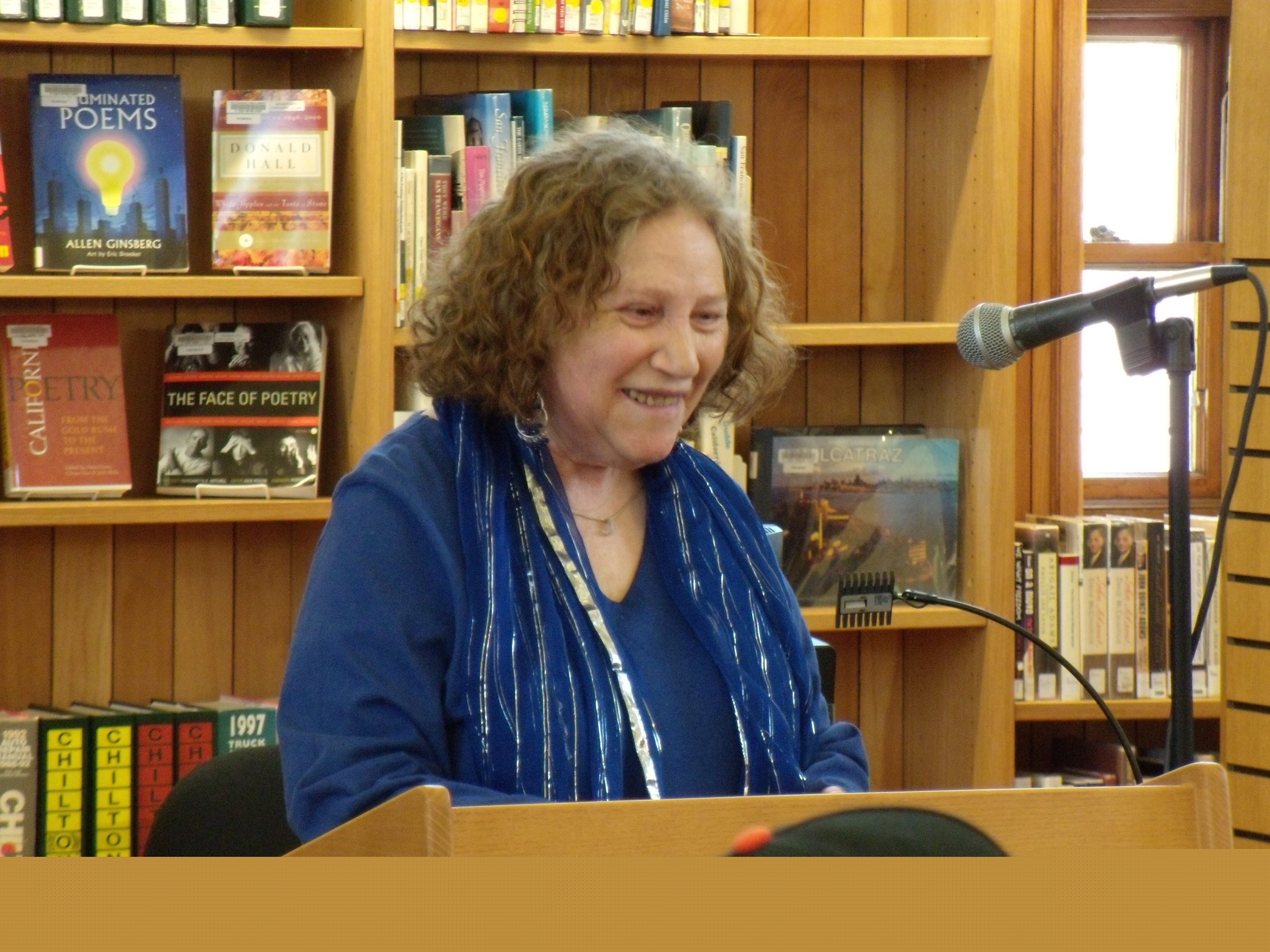 Diane di Prima reading at Public Library in San Francisco photo by Amy Evans McClure